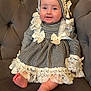 Lanesra is registered to the contest to win money with this photo: baby, child, smiling, dress, lace, bows, couch, indoor, foot, happy, portrait, sitting, hat, adorable, cute, person, infant, furniture, fabric, closeup