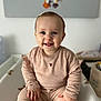 animal, architecture, baby, babylaughing, bear, building, clothing, face, furniture, happy, head, indoors, laughing, livingroom, person, photography, portrait, room, sitting, smile