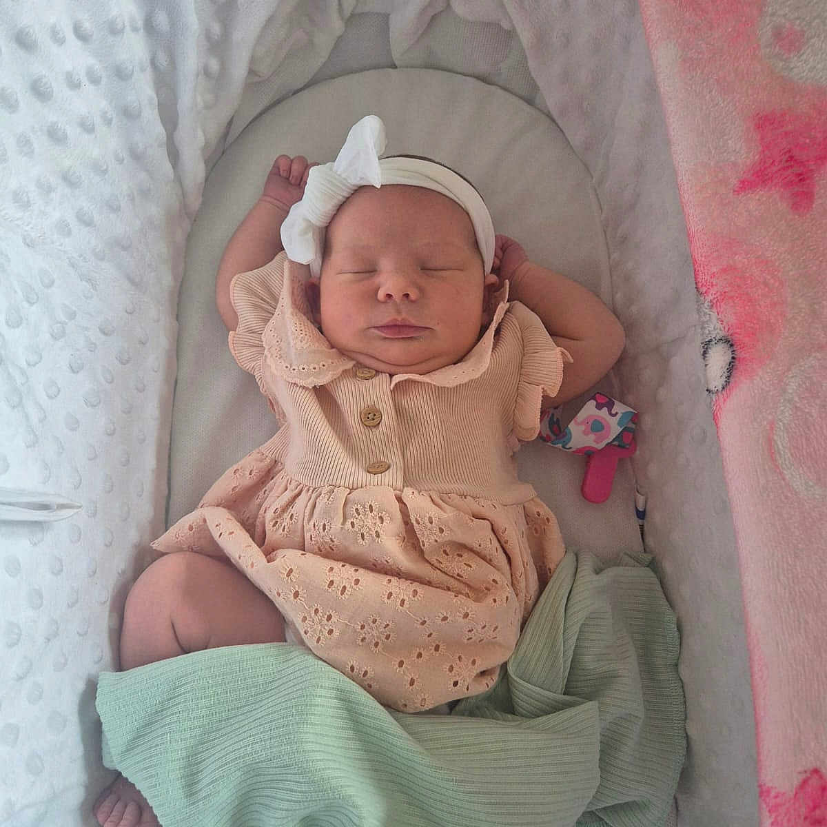 Lillibella is registered to the contest to win money with this photo: baby, bassinet, blanket, bow, child, clothing, cozy, cute, dress, fabric, headband, indoors, infant, newborn, pastel, peaceful, portrait, resting, sleeping, soft