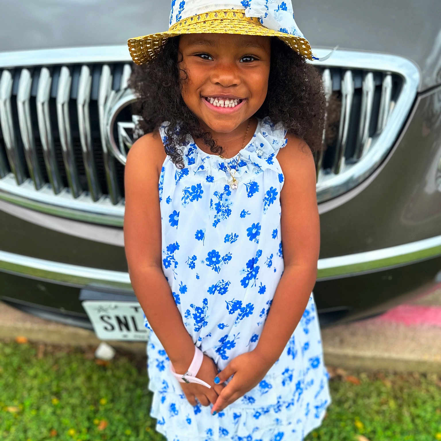 Gianna is registered to the contest to win money with this photo: accessories, car, child, clothing, dress, face, female, girl, happy, hat, head, jewelry, necklace, person, photography, portrait, sleeve, smile, transportation, vehicle