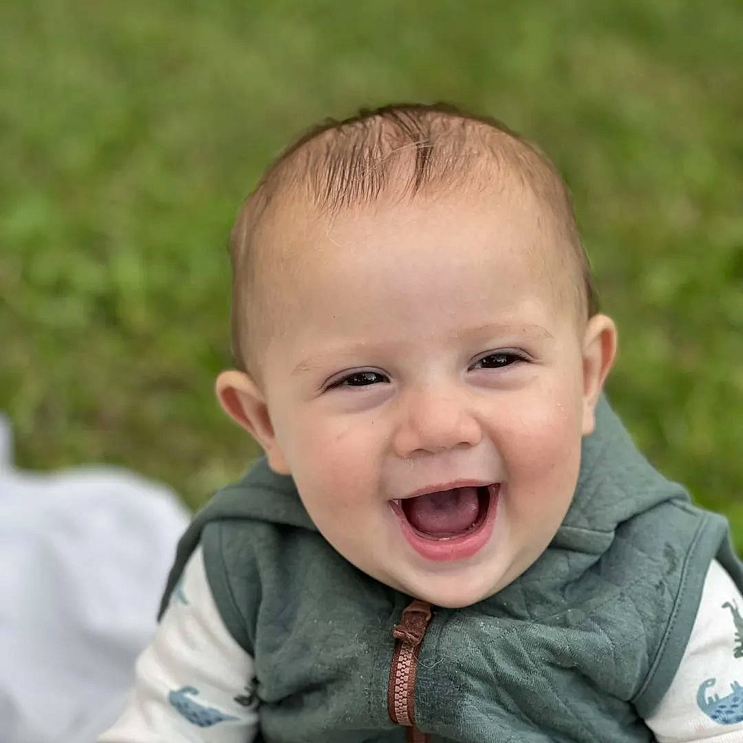 Oaklee joined the competition — help win amazing prizes! baby, baby_toddler_clothing, cheek, child, chin, eye, fun, grass, happy, iris, laugh, lip, nose, people_in_nature, person, sitting, skin, sleeve, smile, toddler