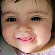 Celine participe au concours pour gagner de l'argent avec cette photo : baby, child, face, smile, tongue, pink_clothing, strap, close_up, cute, young, infant, person, eyelashes, soft_light, happy, cheeks, dark_hair, indoors, portrait, skin