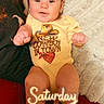 Jesus joined the competition — help win amazing prizes! baby, child, infant, cowboy, onesie, boots, sitting, lying_down, smiling, portrait, indoors, blanket, cushion, text_overlay, saturday, cowboy_hat, clothing, face, happy, photograph