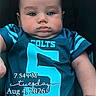 Jesus joined the competition — help win amazing prizes! baby, infant, child, portrait, sitting, football_jersey, colts, sportswear, blue_clothing, number_five, face, eyes, serious_expression, indoor, car_seat, adult_hand, timestamp, text_overlay, close_up, photograph
