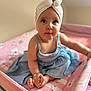 baby, blue, child, clothing, curious, cute, dress, flower, headwear, indoors, infant, person, pink, playpen, portrait, sitting, skin, small_feet, turban, wide_eyes