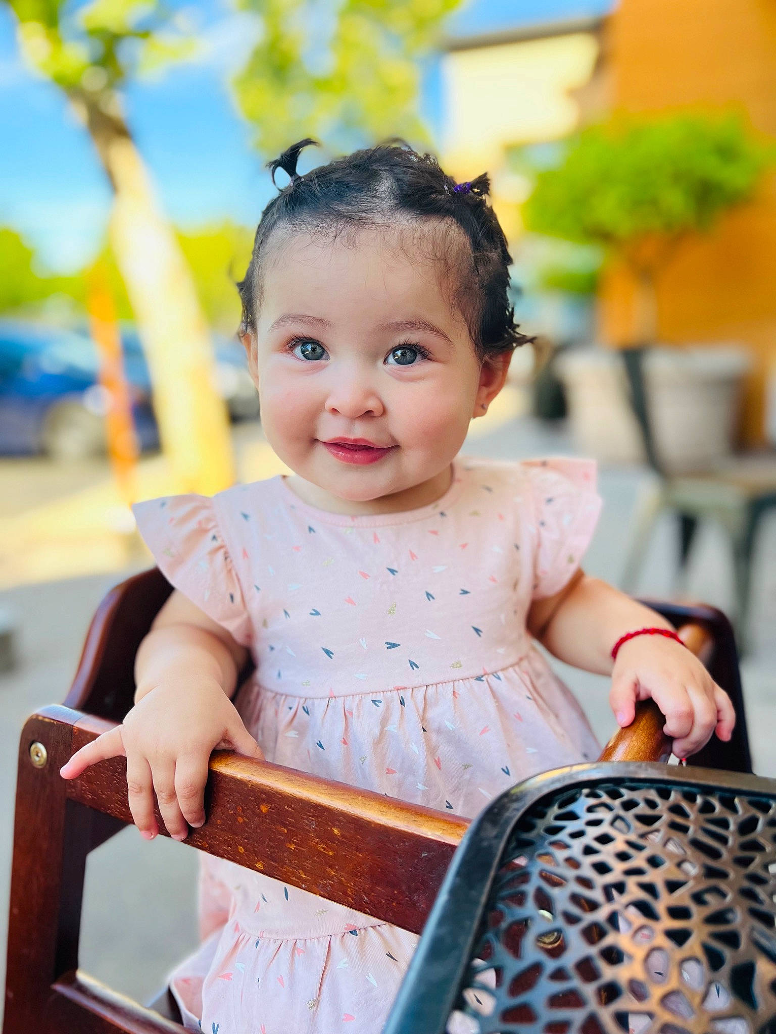 Scarlett Rose is registered to the contest to win money with this photo: baby, baby_toddler_clothing, chair, child, dress, event, flowerpot, fun, happy, houseplant, joy, leisure, peach, person, photograph, plant, recreation, sitting, skin, smile