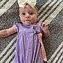 Tatum joined the competition — help win amazing prizes! baby, infant, headband, bow, purple_onesie, yellow_dots, pacifier, pacifier_clip, pink_strap, rug, gray_rug, white_rug, texture, lying_down, looking_at_camera, cute, child, toddler, apparel, indoor