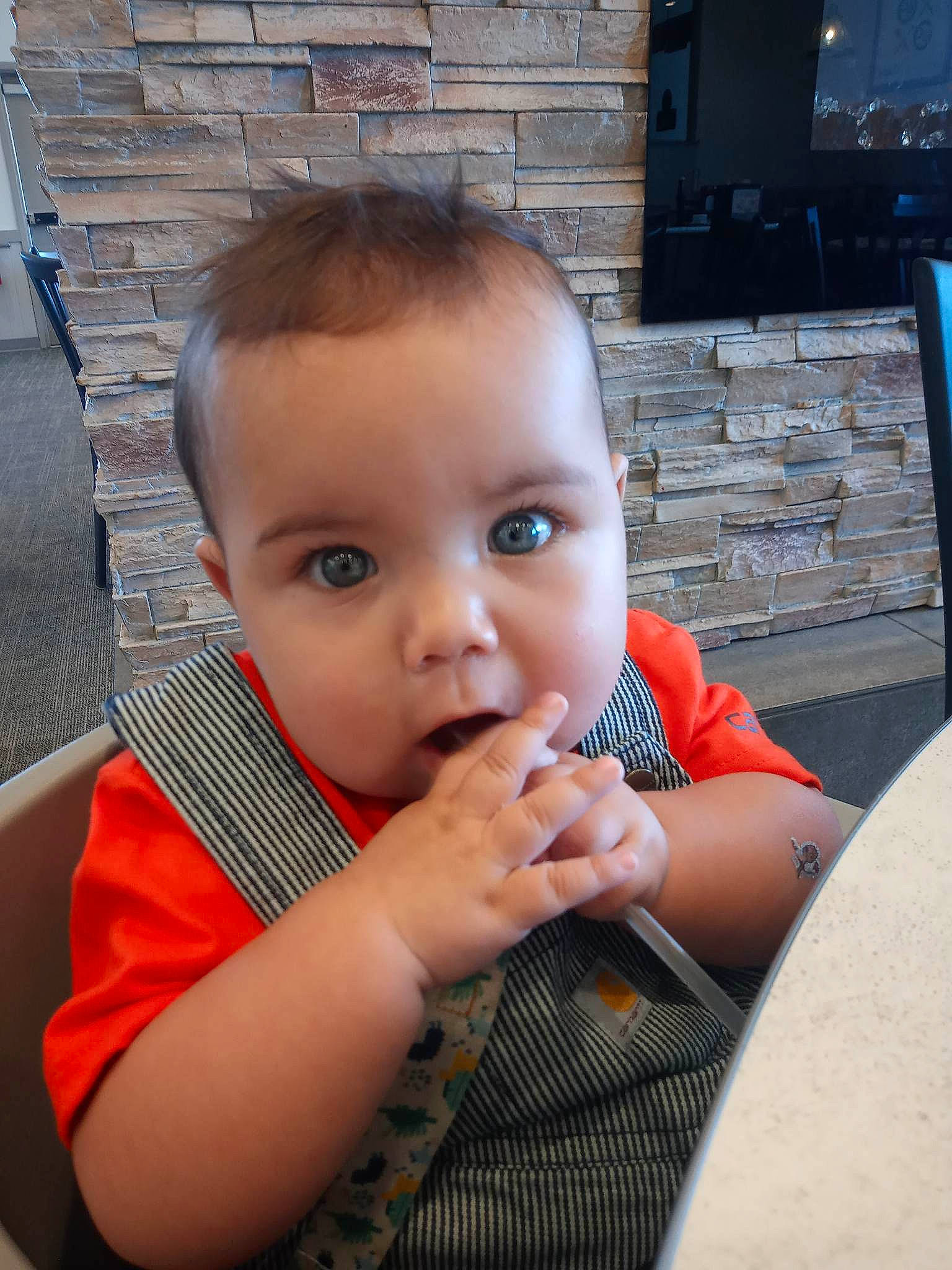 Elliot is registered to the contest to win money with this photo: auto_part, baby, baby_toddler_clothing, cheek, child, eyebrow, eyelash, finger, fun, gesture, happy, leisure, nail, nose, person, sitting, thumb, toddler, vacation, vehicle_door