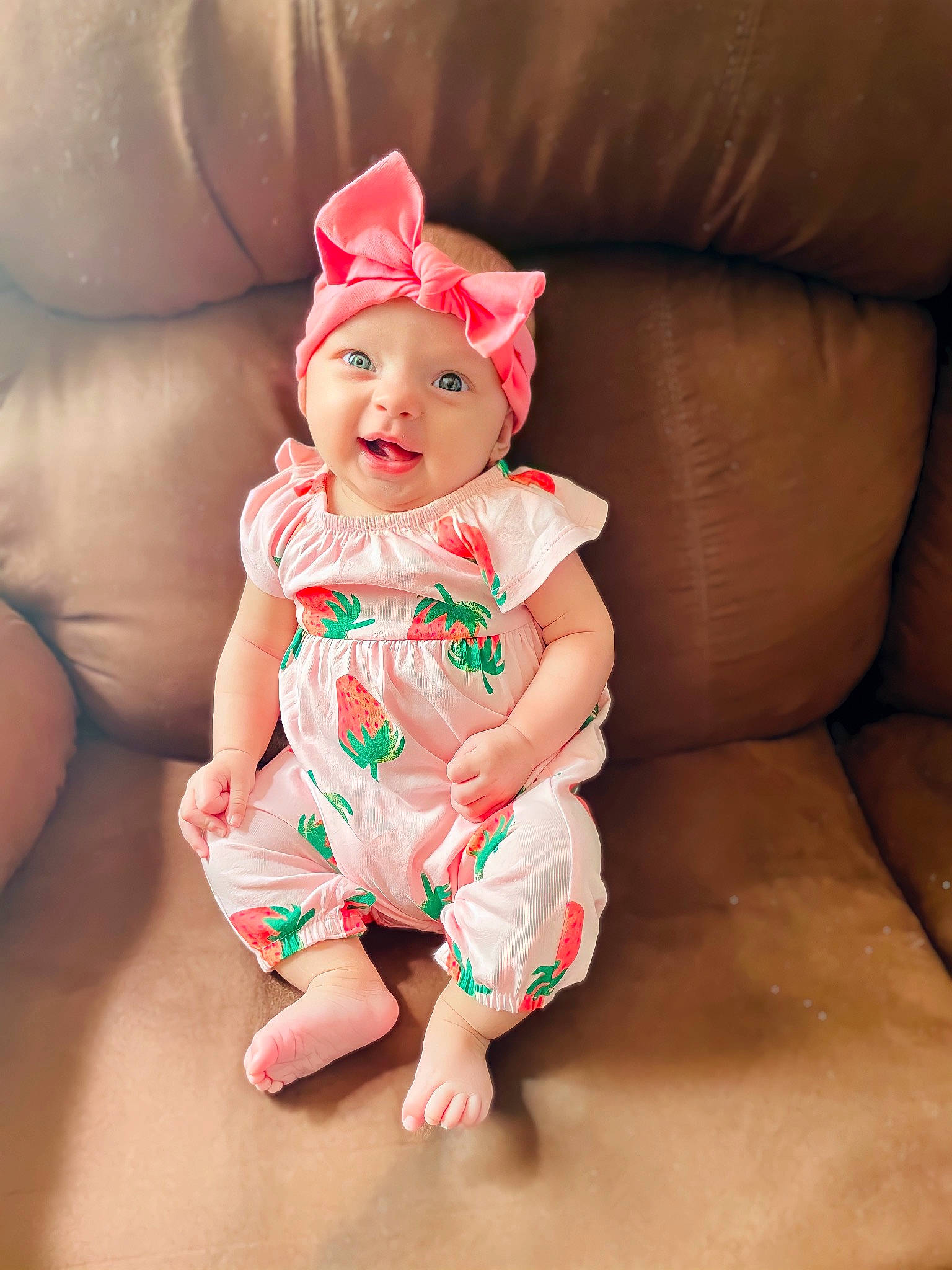 Everlee is registered to the contest to win money with this photo: baby, baby_toddler_clothing, cap, comfort, costume_hat, couch, dress, eye, happy, hat, head, headgear, headwear, human_body, human_leg, leg, person, pink, skin, sleeve