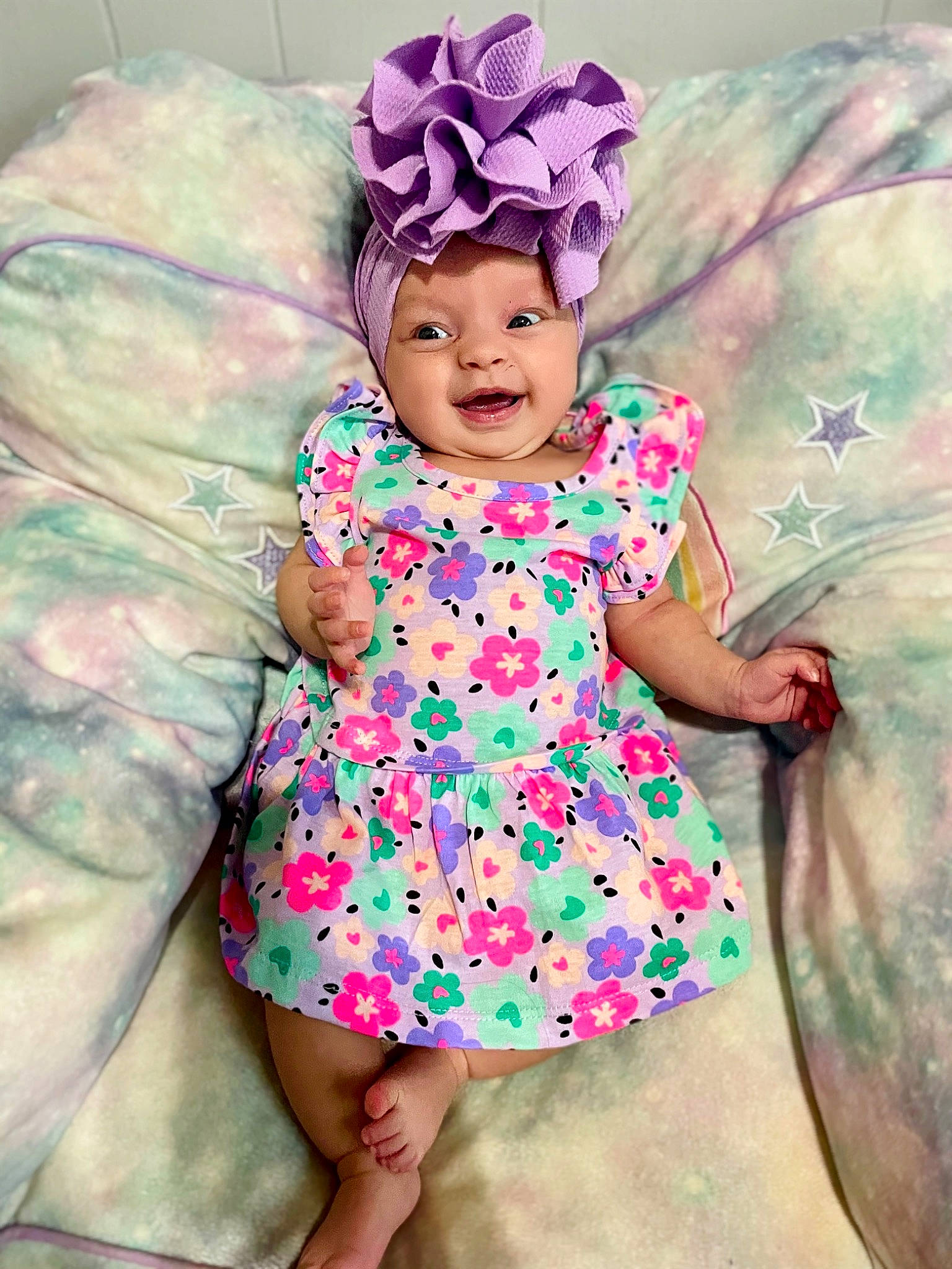 Everlee is registered to the contest to win money with this photo: baby_toddler_clothing, child, day_dress, dress, fun, hairstyle, happy, headgear, headwear, human_body, iris, magenta, pattern, person, pink, plant, purple, skin, sleeve, textile