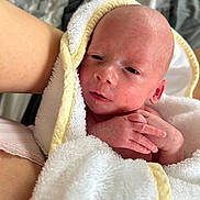 Harlow is registered to the contest to win money with this photo: newborn, baby, towel, wrapped, hands, skin, person, infant, closeup, soft, cozy, blanket, bed, resting, portrait, human, sleepy, cute, care, warm