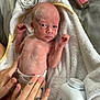 Harlow is registered to the contest to win money with this photo: newborn, baby, infant, towel, hands, diaper, powder, skin, lotion, bottle, tattoo, care, closeup, soft, bed, babycare, human, resting, small, cute