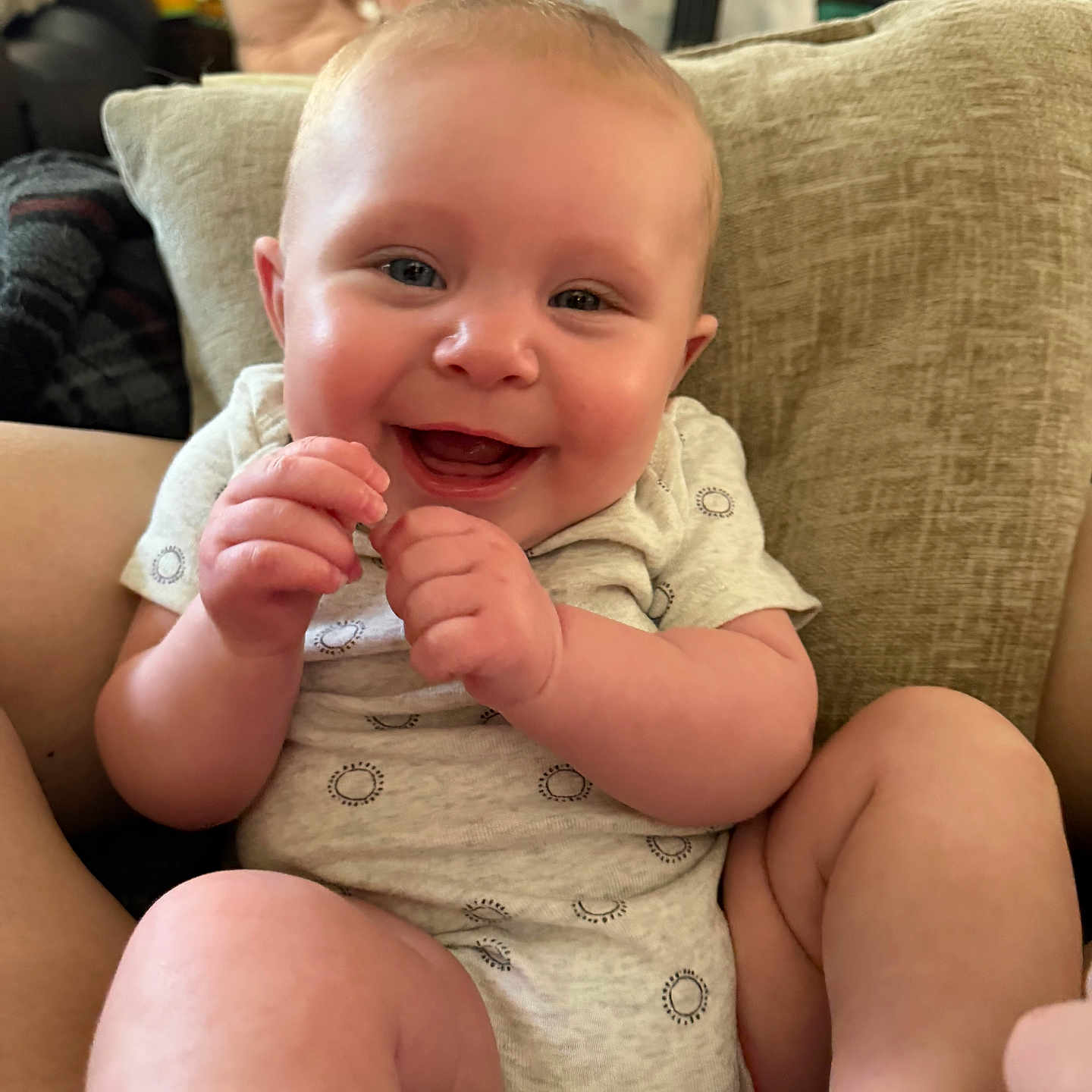 April joined the competition — help win amazing prizes! baby, smiling, happy, infant, cushion, indoor, person, face, skin, clothing, legs, hand, cute, child, young, sitting, comfort, home, joy, expression