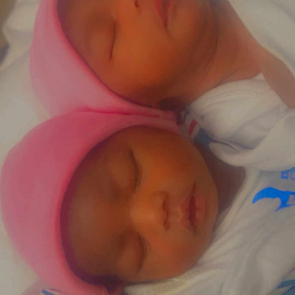 Zariah And Zaniah is registered to the contest to win money with this photo: adorable, baby, blanket, child, closeup, cozy, cute, face, indoors, infant, newborn, peaceful, pink_hat, portrait, rest, sleeping, soft, twin, warm, wrapped