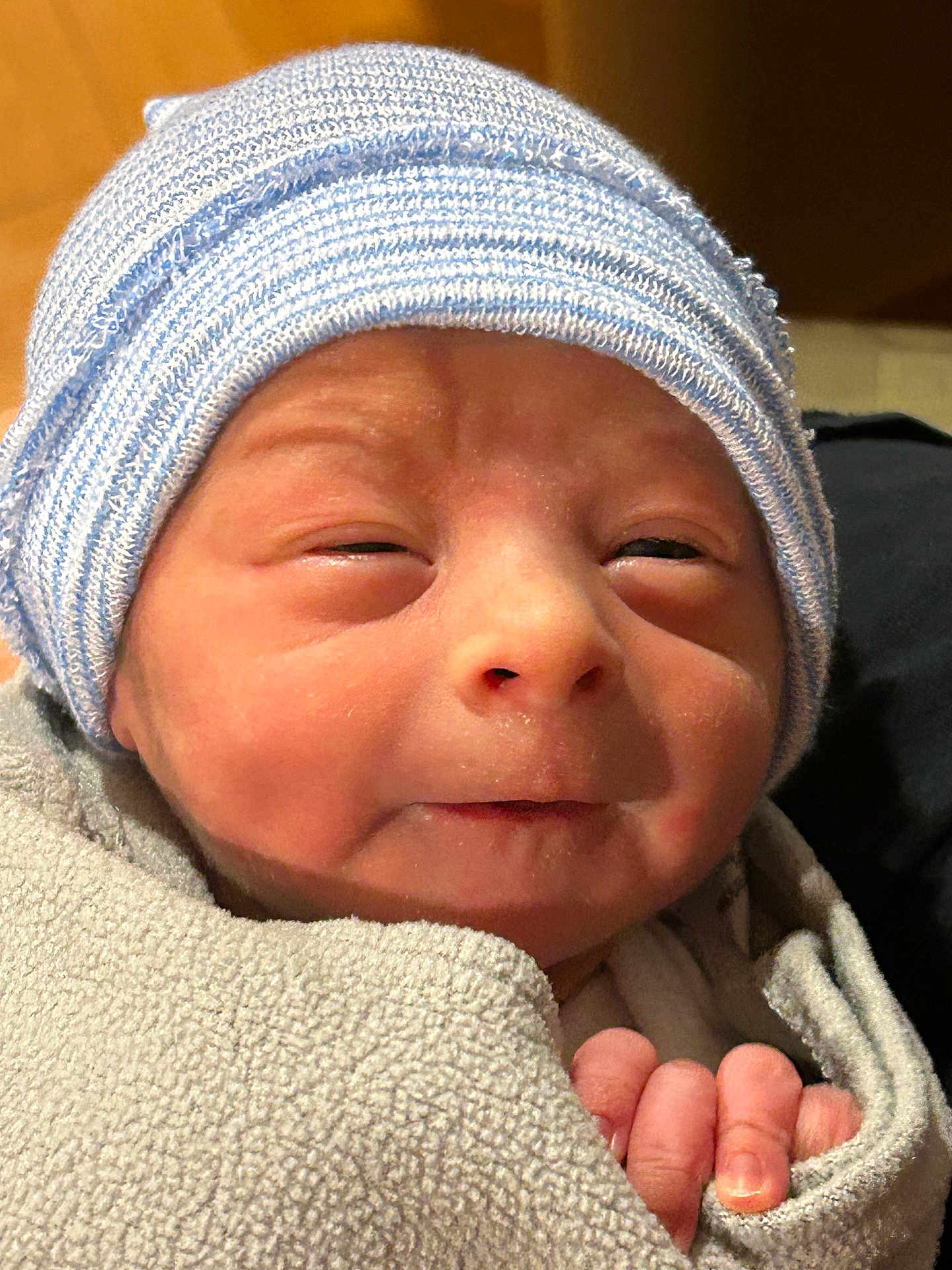 Luke joined the competition — help win amazing prizes! baby, newborn, infant, beanie, knit_hat, swaddle, blanket, close_up, face, eyes_partially_closed, tiny_hand, cheeks, skin, portrait, cute, sleepy, soft_texture, newborn_skin, wrapped, mild_smile