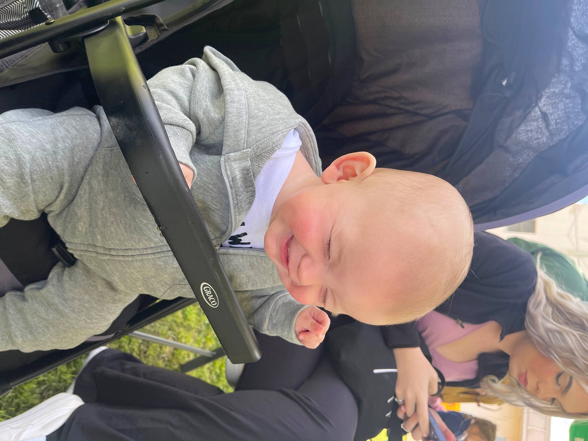 Joseph is registered to the contest to win money with this photo: abdomen, auto_part, baby, baby_carriage, baby_products, car_seat, chest, child, comfort, event, family_car, grass, knee, leisure, person, seat_belt, sitting, smile, thigh, toddler