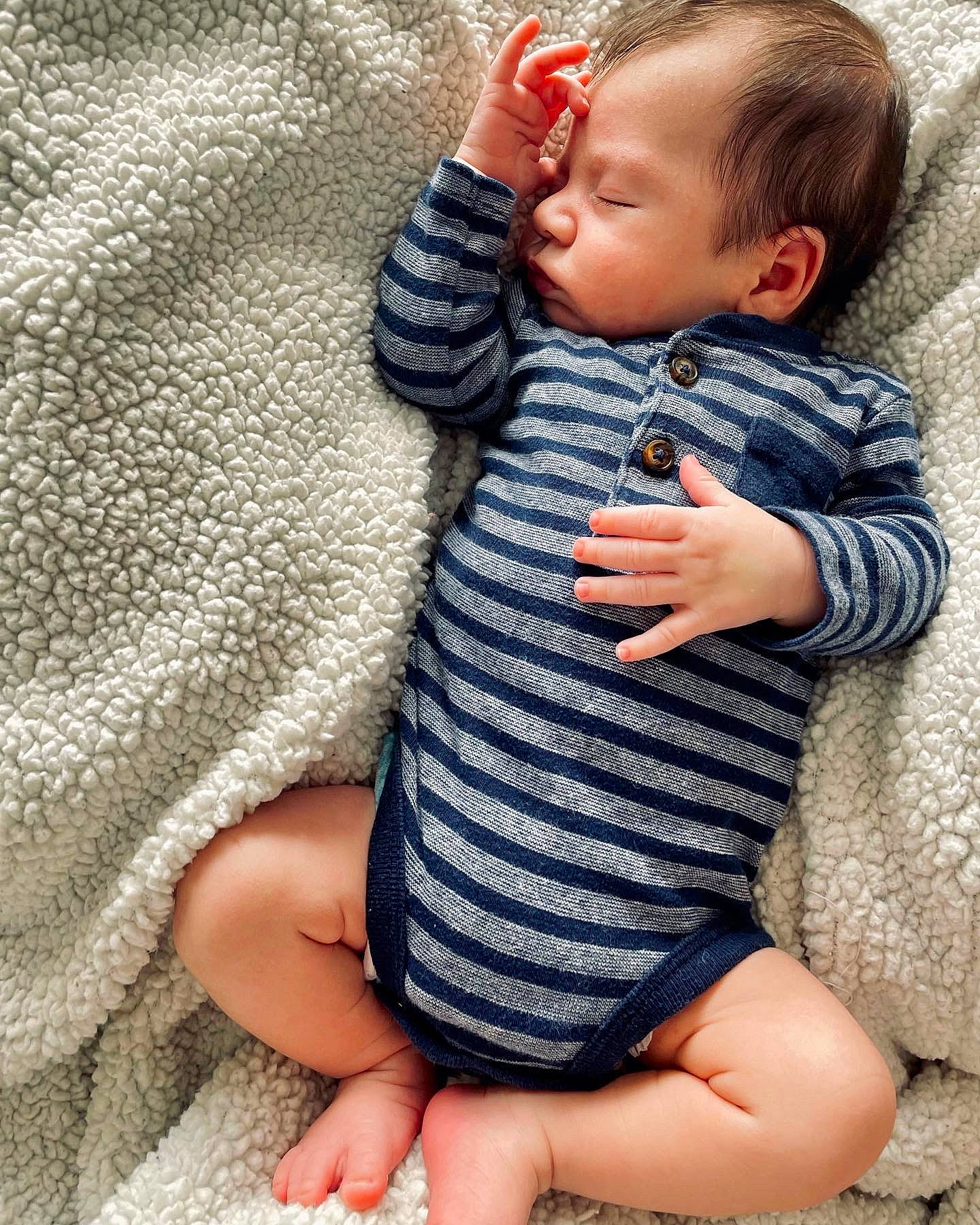 Allen is registered to the contest to win money with this photo: arm, baby, baby_toddler_clothing, comfort, dress, eye, finger, gesture, hair, head, human_body, lip, nail, nose, outerwear, person, skin, sleeve, textile, thumb
