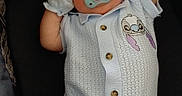 Braxton joined the competition — help win amazing prizes! baby, infant, child, portrait, lying_down, car_seat, pacifier, mittens, onesie, knitwear, cartoon_patch, smiling, indoors, closeup, face, arms_raised, dark_background, clothing, cute, photography