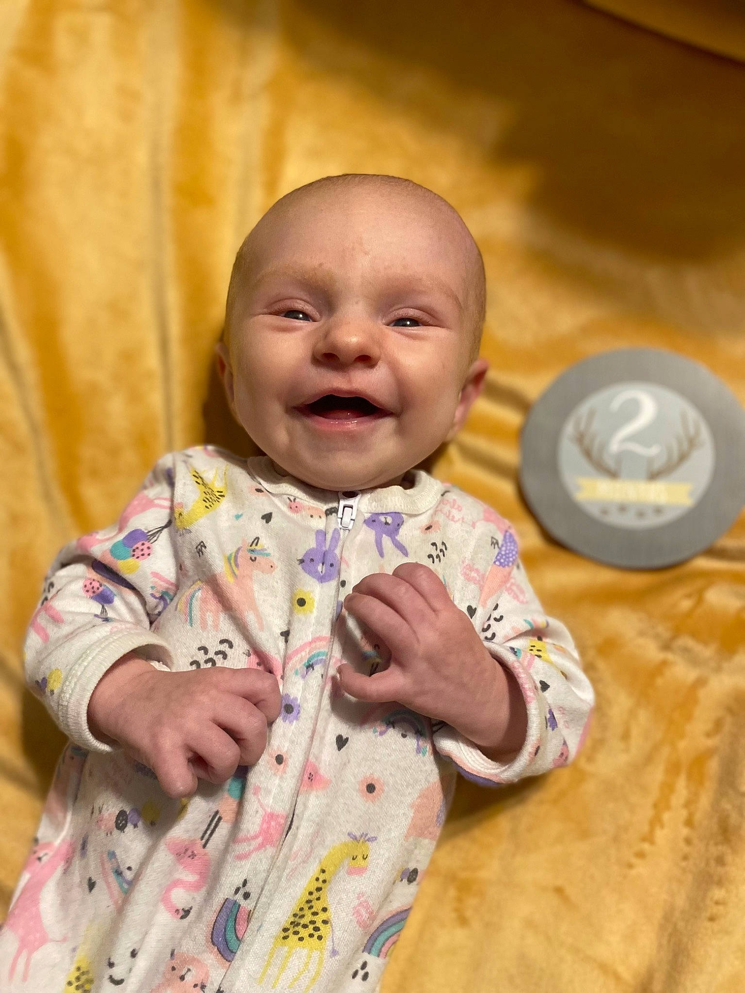 Fiona is registered to the contest to win money with this photo: baby, baby_toddler_clothing, cheek, child, chin, dress, eye, face, flash_photography, fun, happy, head, iris, nose, person, sitting, skin, sleeve, smile, toddler
