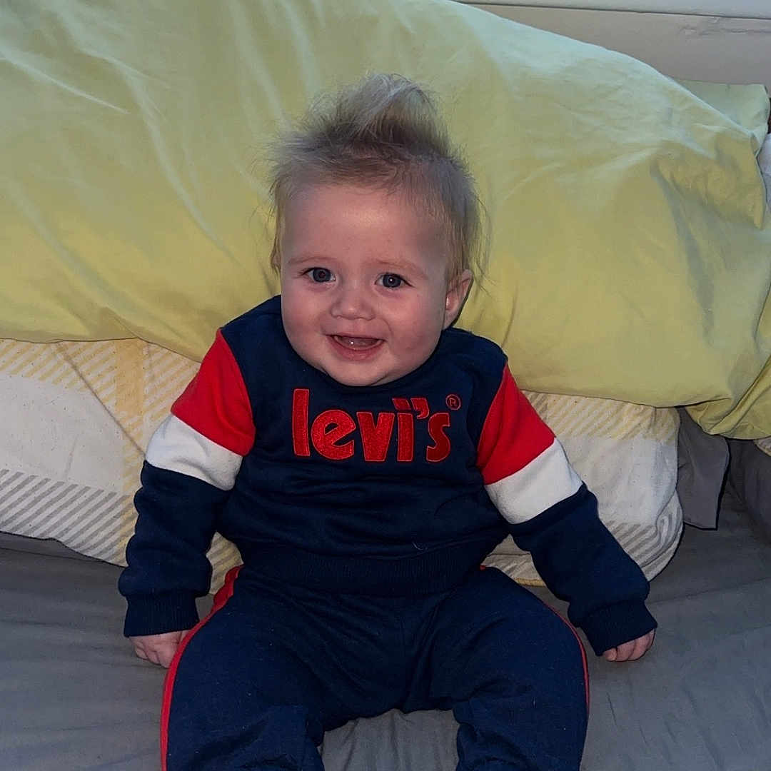 Kobie joined the competition — help win amazing prizes! baby, bed, bedroom, bodypart, clothing, couch, cushion, face, finger, furniture, hand, head, homedecor, indoors, pants, person, photography, portrait, room, sitting
