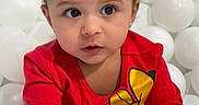 Arianna joined the competition — help win amazing prizes! ball_pit, bright_colors, casual_wear, child, childrens_clothing, curious, cute, expression, face, fun, indoors, long_sleeve, minnie_mouse, person, playful, portrait, red_shirt, toddler, white_balls, young_child