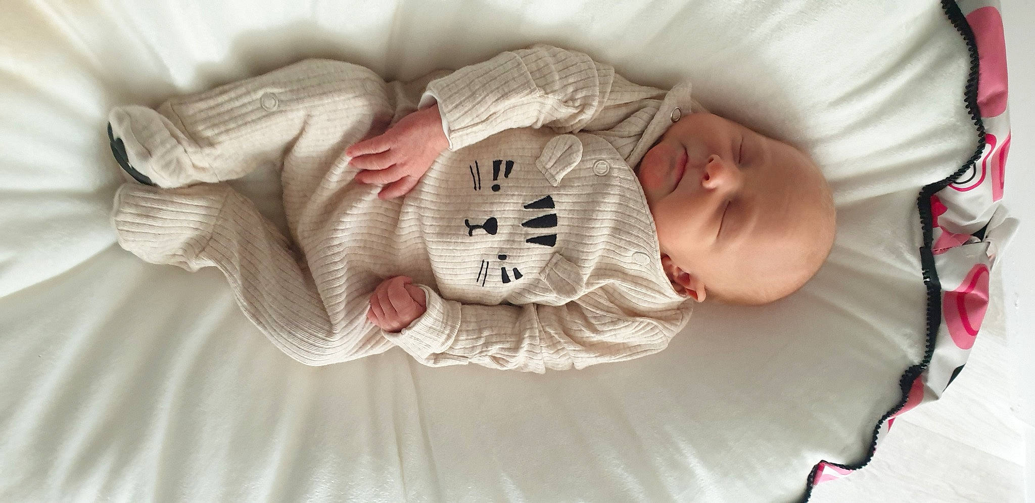 Priya is registered to the contest to win money with this photo: arm, baby, baby_products, baby_sleeping, baby_toddler_clothing, bed, bedtime, cheek, comfort, eye, finger, hand, headgear, human_body, linens, person, skin, sleeve, textile, toddler