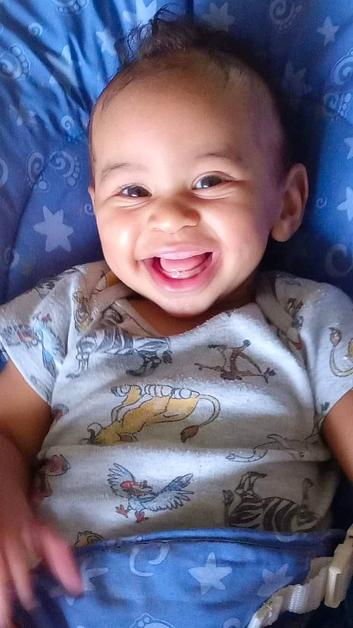 Kamari is registered to the contest to win money with this photo: baby, cheek, chin, cool, eyebrow, facial_expression, flash_photography, forehead, gesture, happy, iris, joy, mammal, mouth, nose, organ, person, plant, product, skin