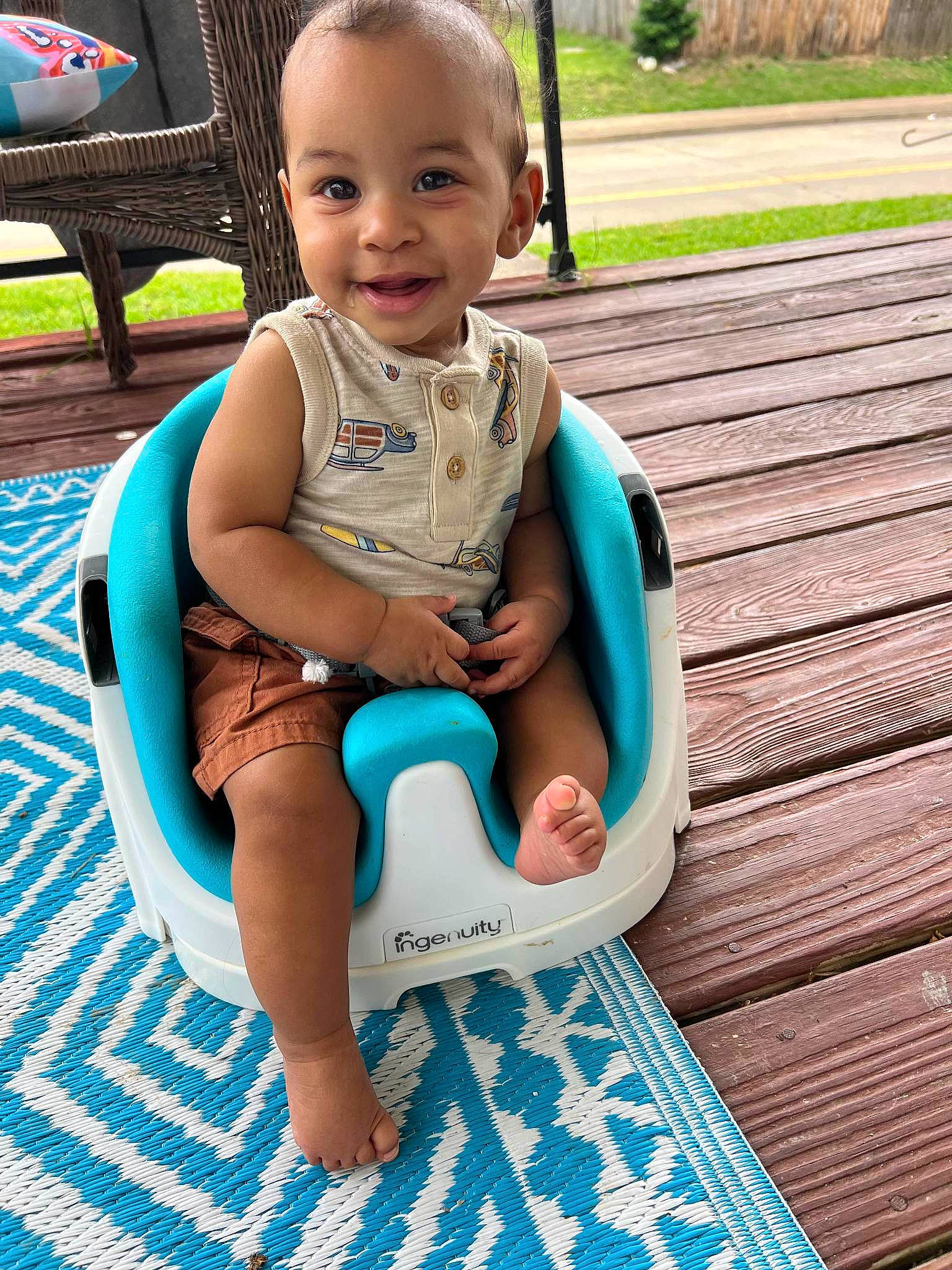 Kamari is registered to the contest to win money with this photo: aqua, baby, baby_toddler_clothing, blue, child, comfort, eye, face, facial_expression, fun, grass, green, happy, head, joy, leg, leisure, person, product, skin