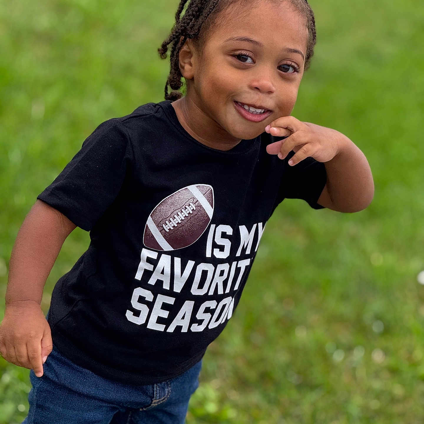 Damien is registered to the contest to win money with this photo: ball, boy, braid, child, clothing, face, hair, happy, head, jeans, male, pants, person, photography, portrait, rugby, rugbyball, sleeve, sport, t_shirt