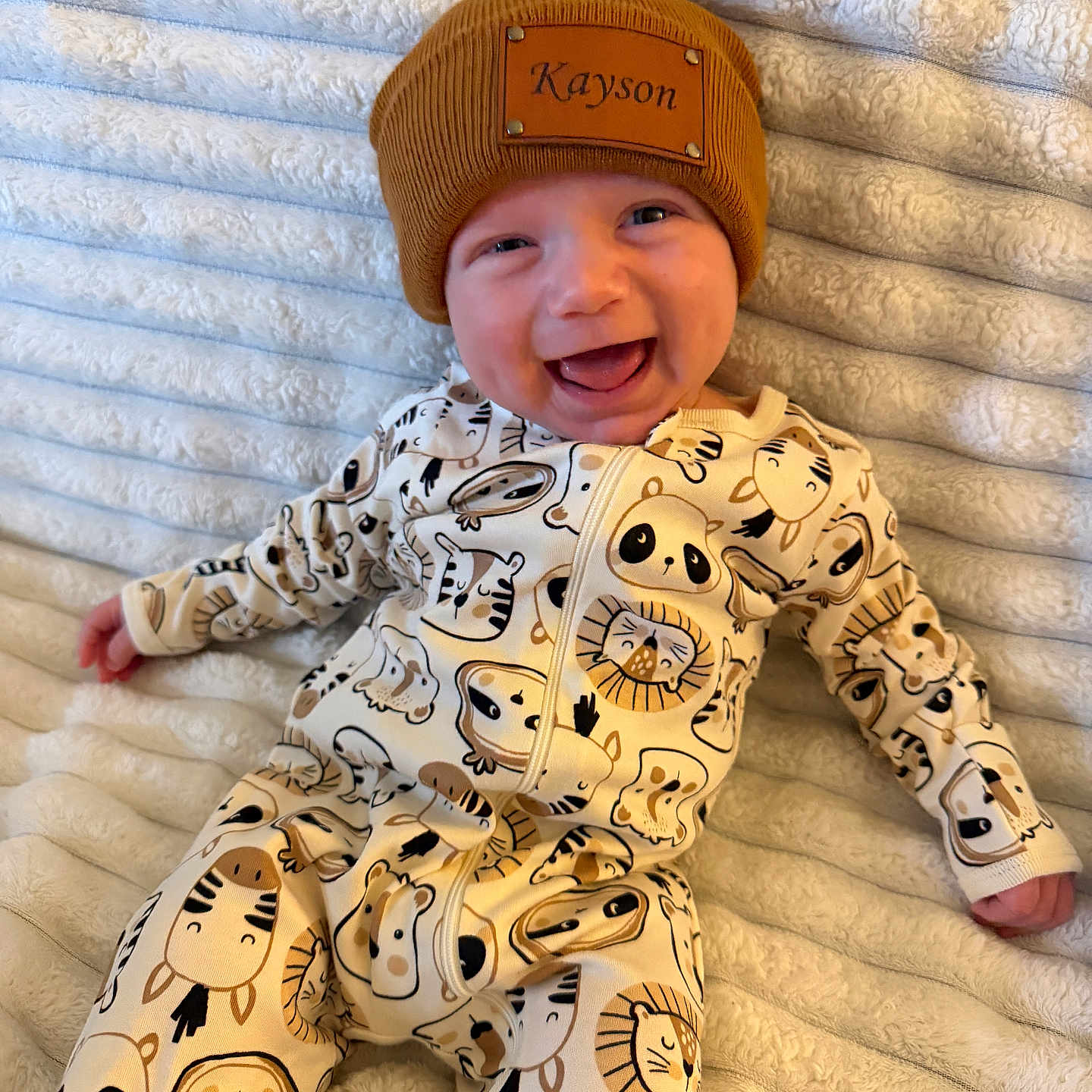 Kayson joined the competition — help win amazing prizes! baby, infant, smiling, beanie, hat, animal_print, onesie, blanket, happy, cute, child, face, clothing, lying_down, portrait, cozy, infant_clothing, warm, soft, babywear
