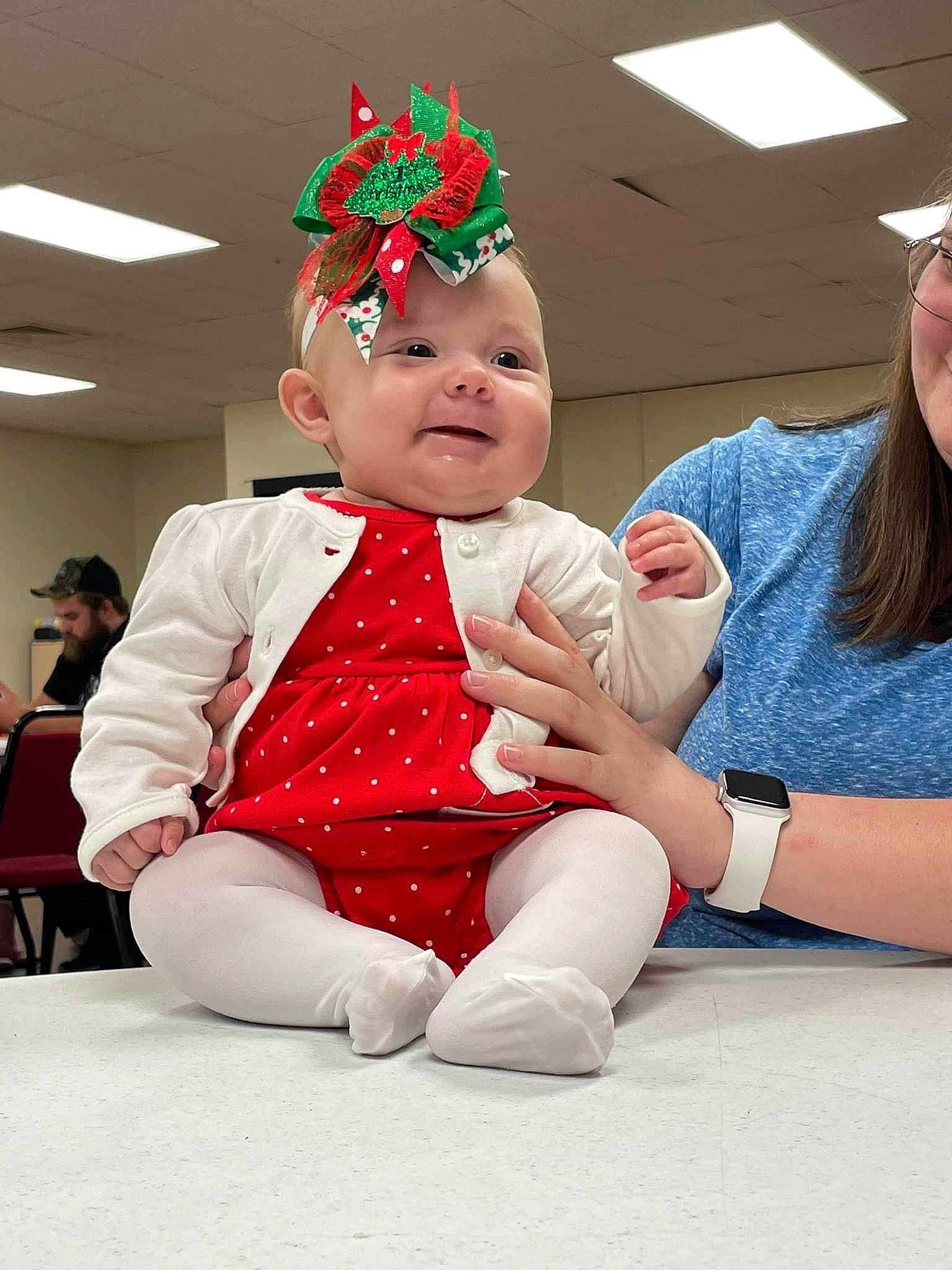 Baylee joined the competition — help win amazing prizes! baby, baby_toddler_clothing, carmine, child, christmas, christmas_eve, clothing, costume, costume_hat, event, fashion_accessory, fictional_character, fun, happy, hat, headwear, holiday, lap, party_supply, person