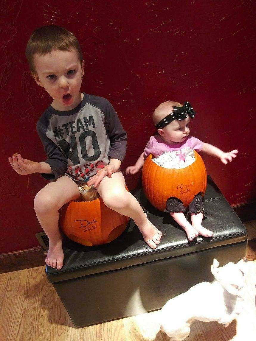 Daxton is registered to the contest to win money with this photo: art, child, doll, flooring, foot, fun, hairstyle, happy, headwear, joint, knee, mammal, musical_instrument, orange, person, room, shorts, sitting, surprise, thigh