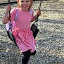 Laila is registered to the contest to win money with this photo: child, girl, swing, playground, smiling, pink_dress, sunglasses, black_leggings, bracelet, sneakers, sunny_day, outdoor, happy, play, fun, wood_chips, backpack, daylight, person, casual_clothing