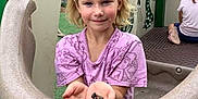 Remi joined the competition — help win amazing prizes! child, girl, playground, rocks, headband, purple_shirt, smiling, outdoor, play_equipment, hands, short_hair, park, kids, casual_clothing, greenery, daylight, happy, people, recreation, fun