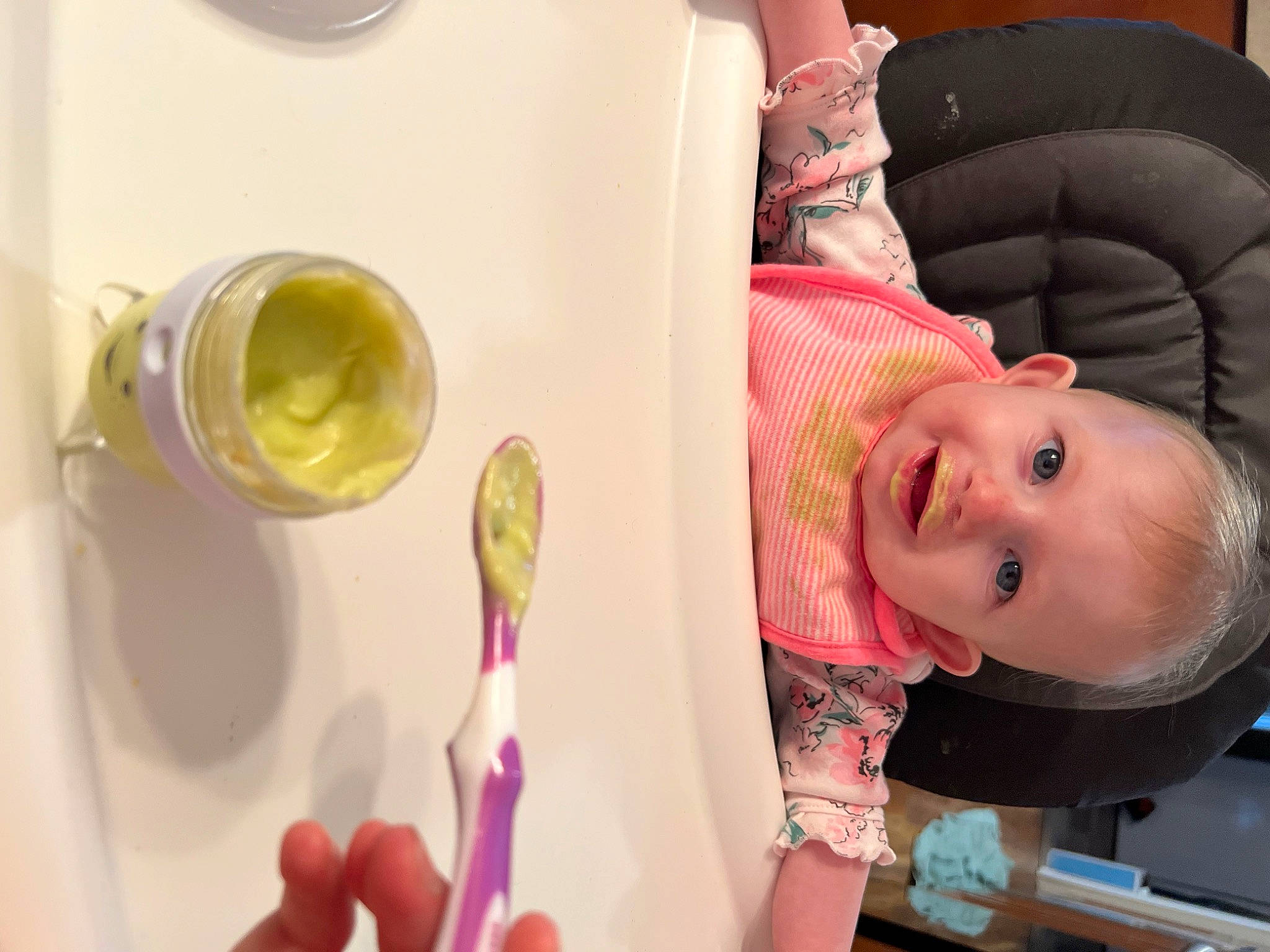 Jocelyn joined the competition — help win amazing prizes! baby, baby_products, baby_toddler_clothing, child, comfort, drinkware, finger, fun, gesture, kitchen_utensil, magenta, person, pink, purple, room, serveware, smile, spoon, tableware, toddler