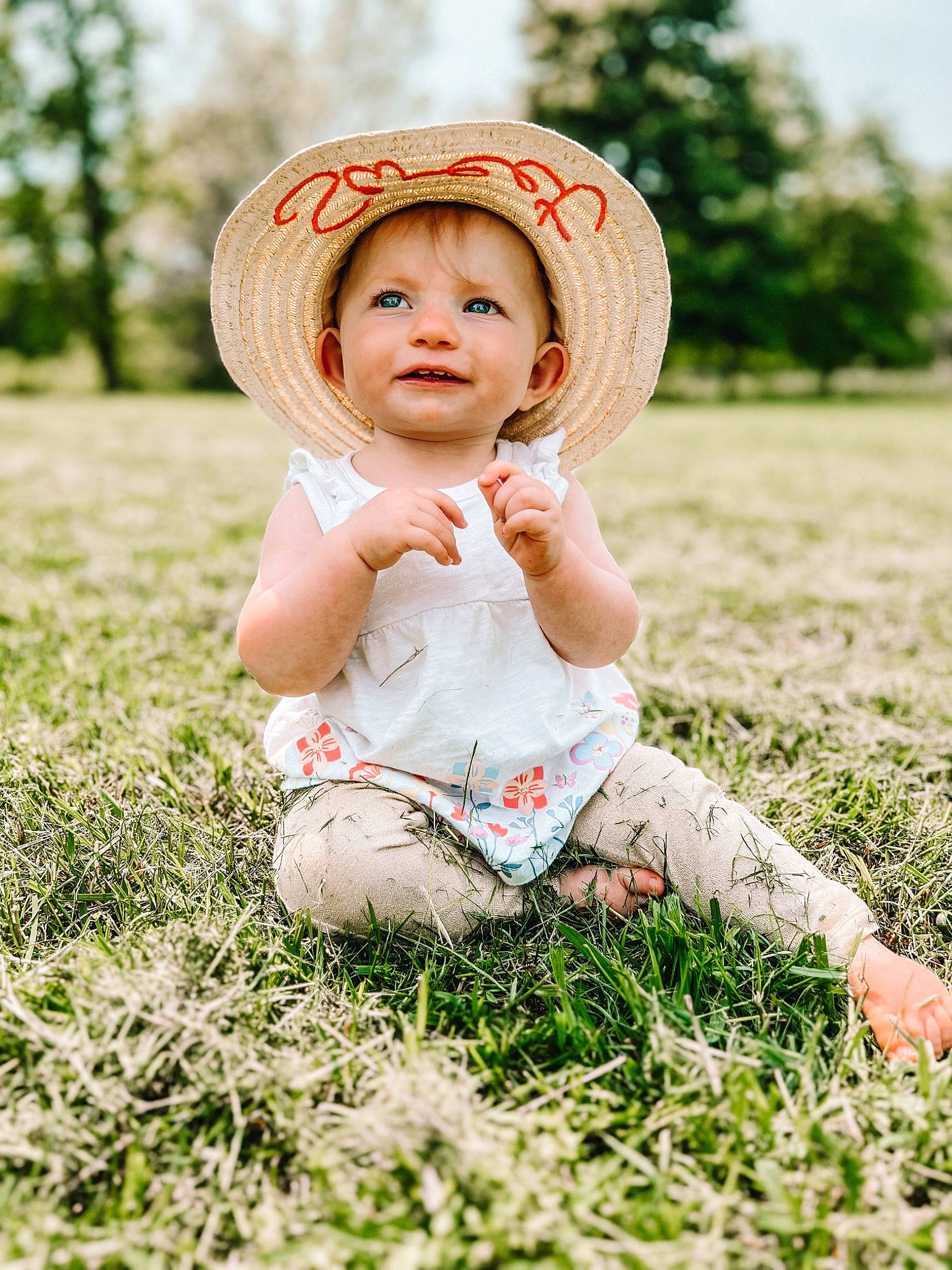 Jocelyn is registered to the contest to win money with this photo: baby_toddler_clothing, child, face, flash_photography, fun, grass, grass_family, grassland, happy, hat, headgear, headwear, meadow, people_in_nature, person, plant, playing_with_kids, smile, summer, sun_hat
