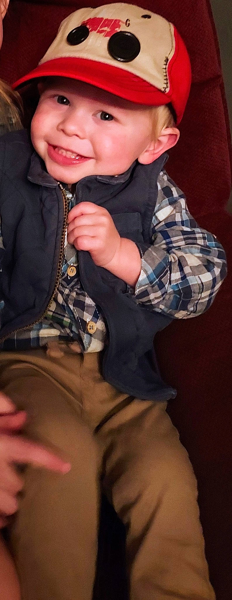 Tucker is registered to the contest to win money with this photo: baby_toddler_clothing, cheek, collar, cool, dress_shirt, eyelash, finger, flash_photography, gesture, headwear, joy, lip, mouth, neck, nose, outerwear, person, plaid, skin, sleeve