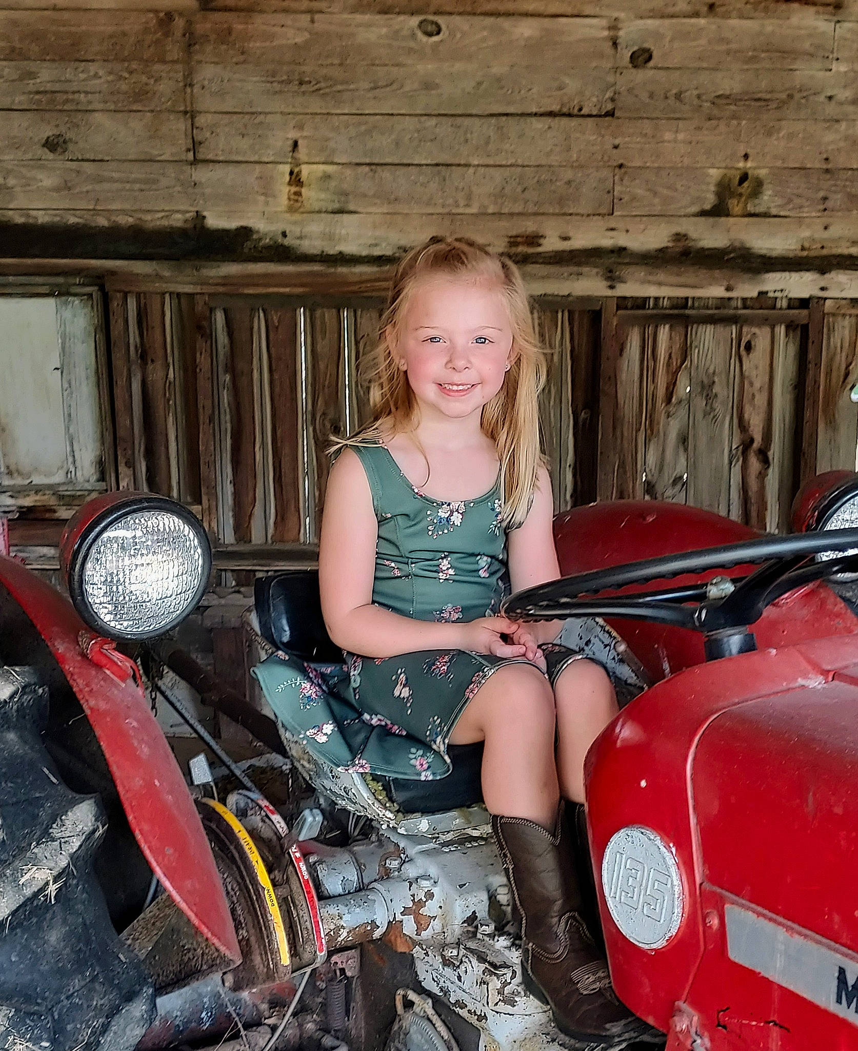 Jessa is registered to the contest to win money with this photo: auto_part, automotive_design, automotive_exterior, automotive_lighting, automotive_tire, automotive_wheel_system, blond, bumper, classic, fender, fun, headlamp, human_leg, joy, motor_vehicle, person, rim, sitting, smile, vehicle