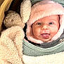 Alba participe au concours pour gagner de l'argent avec cette photo : baby, face, tongue, hat, knitwear, plush_toy, bunny, blanket, cozy, smile, child, cute, infant, warm, soft, cute_expression, person, portrait, indoors, snuggled