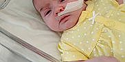 Rosie joined the competition — help win amazing prizes! baby, bed, blanket, child, crib, cute, face, feeding_tube, healthcare, hospital, human, infant, medical, newborn, patient, polka_dots, resting, sleepy, tape, yellow_clothing