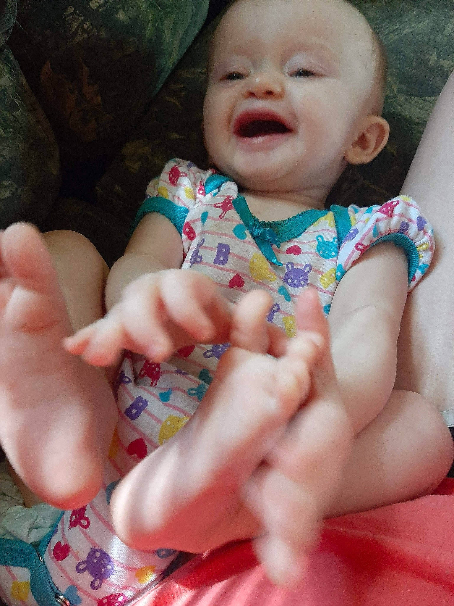 Lois is registered to the contest to win money with this photo: baby, cheek, child, facial_expression, finger, hand, leg, lip, mouth, nail, nose, person, skin, smile, thumb, toddler