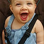 baby, child, smiling, happy, car_seat, seatbelt, blue_dress, infant, cute, face, skin, cheerful, sitting, straps, young, person, indoors, human, expression, little