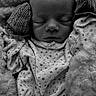 Penelope is registered to the contest to win money with this photo: baby, newborn, sleeping, black_and_white, blanket, mittens, clothing, infant, peaceful, portrait, soft_texture, closeup, cute, resting, face, head, cozy, toddler, sleep, child