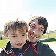 Colson joined the competition — help win amazing prizes! child, adult, smiling, selfie, outdoor, daylight, grass, sky, happy, jacket, casual_clothing, portrait, people, face, young_boy, man, sunny, nature, leisure, fun