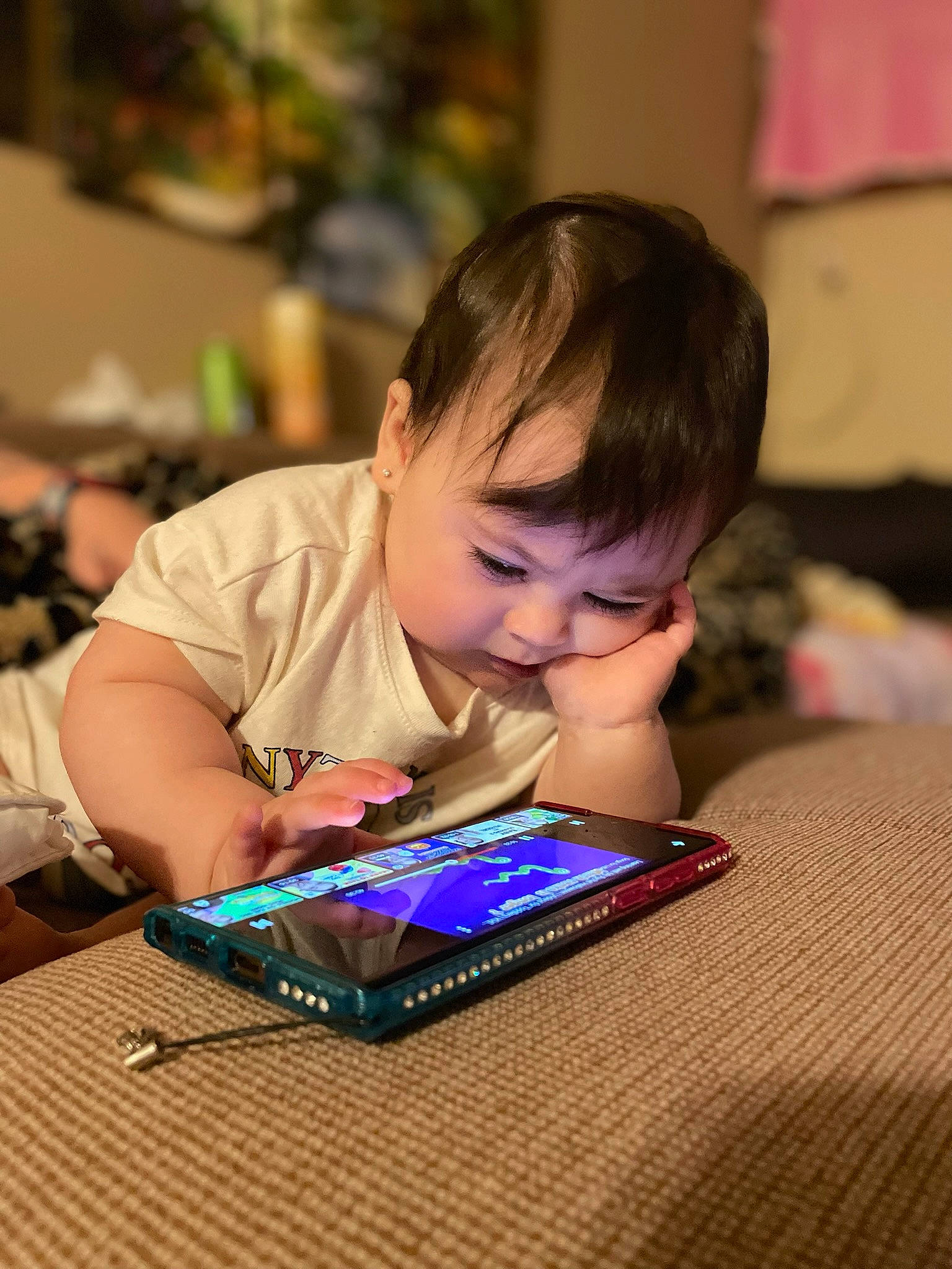 Tallulah joined the competition — help win amazing prizes! child, communication_device, electronic_device, event, flooring, fun, gadget, games, hairstyle, indoor_games_and_sports, office_equipment, person, play, purple, room, sharing, sitting, t_shirt, tablet_computer, toddler