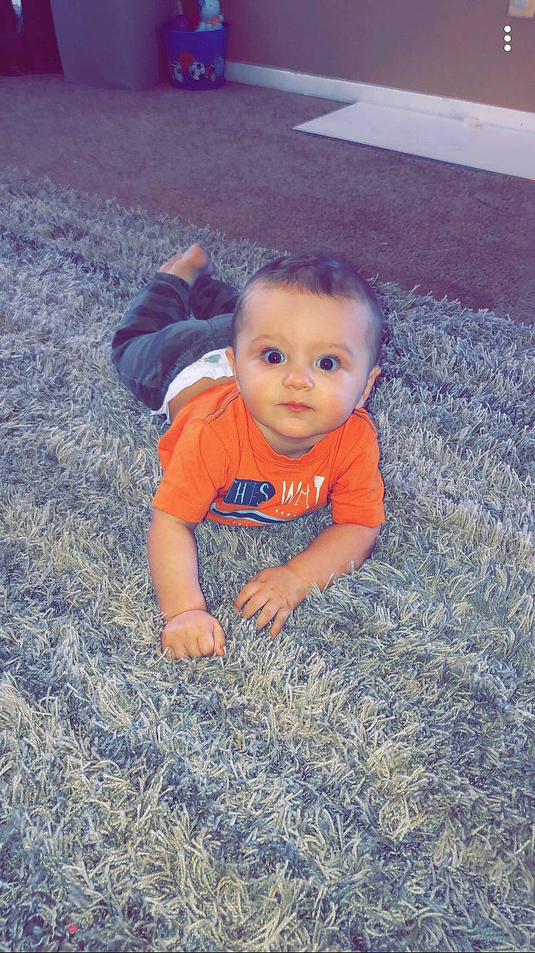 Kalvin joined the competition — help win amazing prizes! baby, child, crawling, face, fun, grass, head, person, plant, play, sitting, skin, smile, toddler, vacation