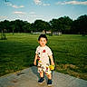 Nicholas joined the competition — help win amazing prizes! child, toddler, boy, outdoor, park, grass, tree, sky, cloud, concrete, path, green, mickey_mouse, clothing, shoes, holding, sippy_cup, sunny, daytime, nature
