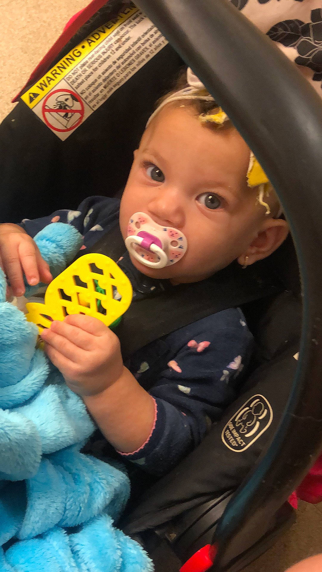 Mars is registered to the contest to win money with this photo: automotive_tire, baby, baby_playing_with_toys, baby_products, baby_toddler_clothing, car_seat, cheek, child, eyelash, fun, happy, iris, nose, person, play, rim, sitting, steering_wheel, stuffed_toy, sweetness
