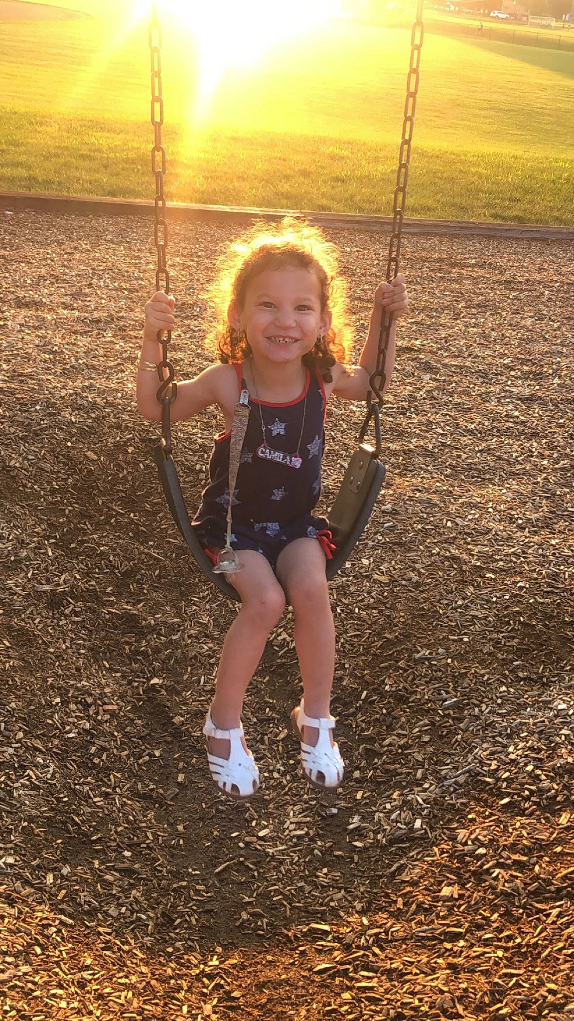 Camila joined the competition — help win amazing prizes! child, city, fun, grass, happy, joy, leisure, outdoor_play_equipment, people_in_nature, person, play, playground, playing_sports, recreation, smile, soil, spring, summer, sunlight, swing