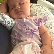 Aurora joined the competition — help win amazing prizes! baby, sleeping, infant, purple_outfit, blanket, butterfly_pattern, peaceful, cute, child, soft, cozy, hand, face, indoor, couch, pillow, relaxation, newborn, person, portrait